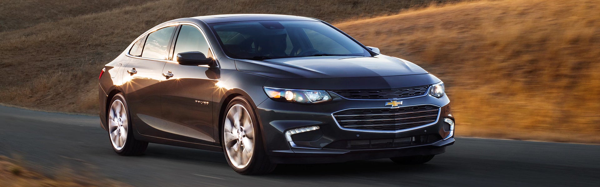 black 2018 Chevrolet Malibu running on road