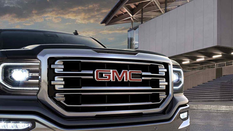 black GMC Sierra 1500 standing near building